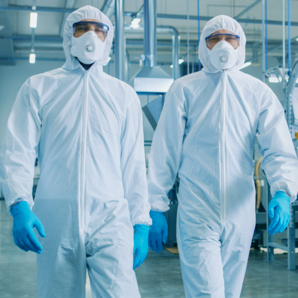 Two men in full coverage, protective gear walking